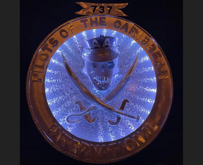 A lighted sign with the words " 7 3 2 mystic of the caribbean."